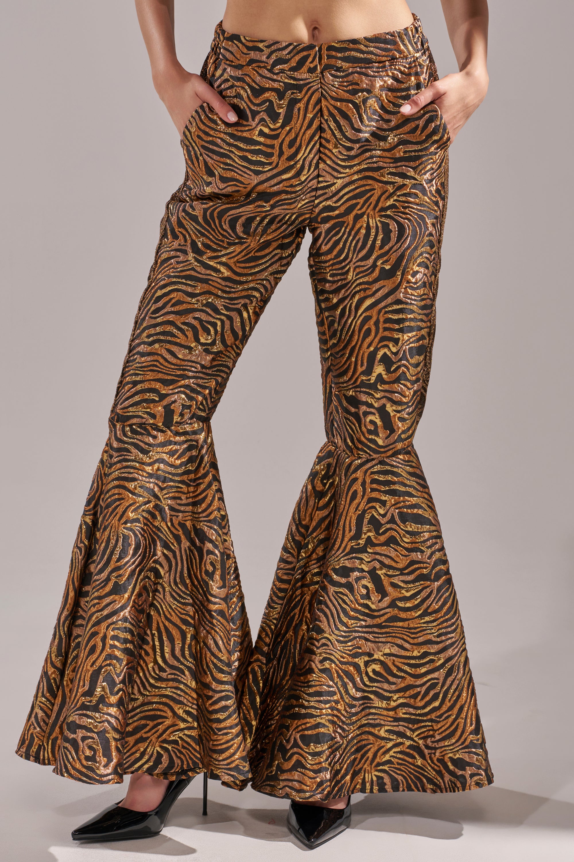 A person wearing GET IN MOTION BROCADE FLARE TROUSER. 2