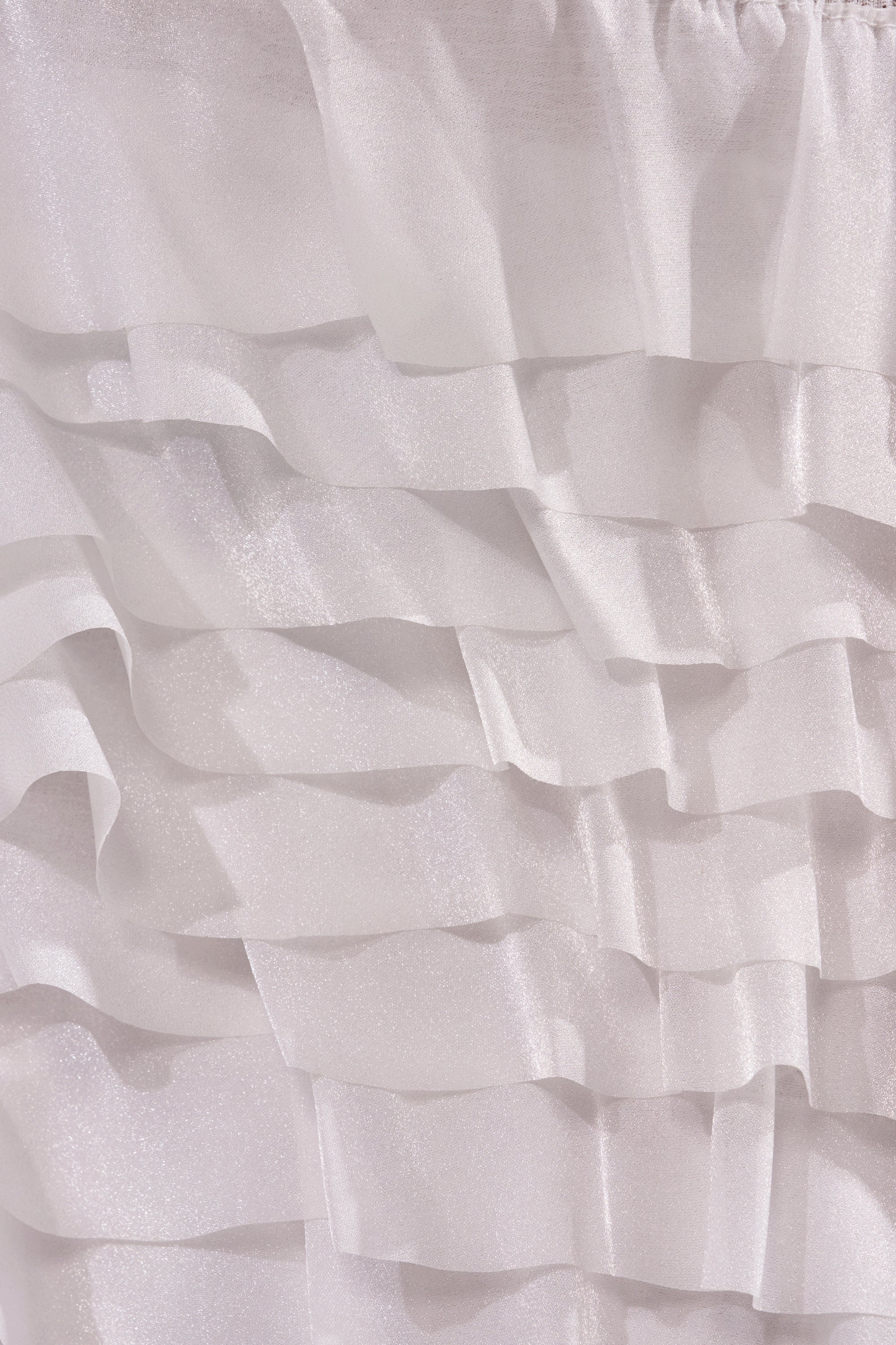 Sheer, shimmery white fabric forms horizontal layered ruffles, adding soft texture and chic style to the TAKE ME AWAY MINI SKIRT. 6