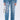 Wearing KEY TO THE CITY RELAXED FIT JEANS—inspired blue, mid-rise denim with metal key details—a person holds a small metallic chain purse and wears open-toed heels, all set against a plain white background.