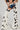 MOO OVER COW PRINT FAUX LEATHER CHAPS
