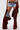 A person stands against a plain white background wearing frayed denim shorts, a belt, and INCREDIBLE VELVET DENIM CHAPS—one leg fully on, the other revealing the shorts.