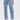 A person wearing IN THE MOOD DENIM PANT with cuffed hems and heeled sandals stands facing away, highlighting the straight-leg fit, two back pockets, and a visible brand label on the waistband.