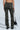 A person is seen from the rear wearing the 