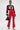 A woman poses in SEXY FAUX LEATHER RED LACE-UP PANTS, a cropped black and red 