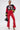 A woman poses confidently in SEXY FAUX LEATHER RED LACE-UP PANTS, paired with a black cropped 