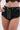 Wearing the BABY PLZ FAUX LEATHER STUD HOT SHORT—high-waisted black faux leather shorts with studs, a front zipper, and matching studded belt—paired effortlessly with a black lace crop top.