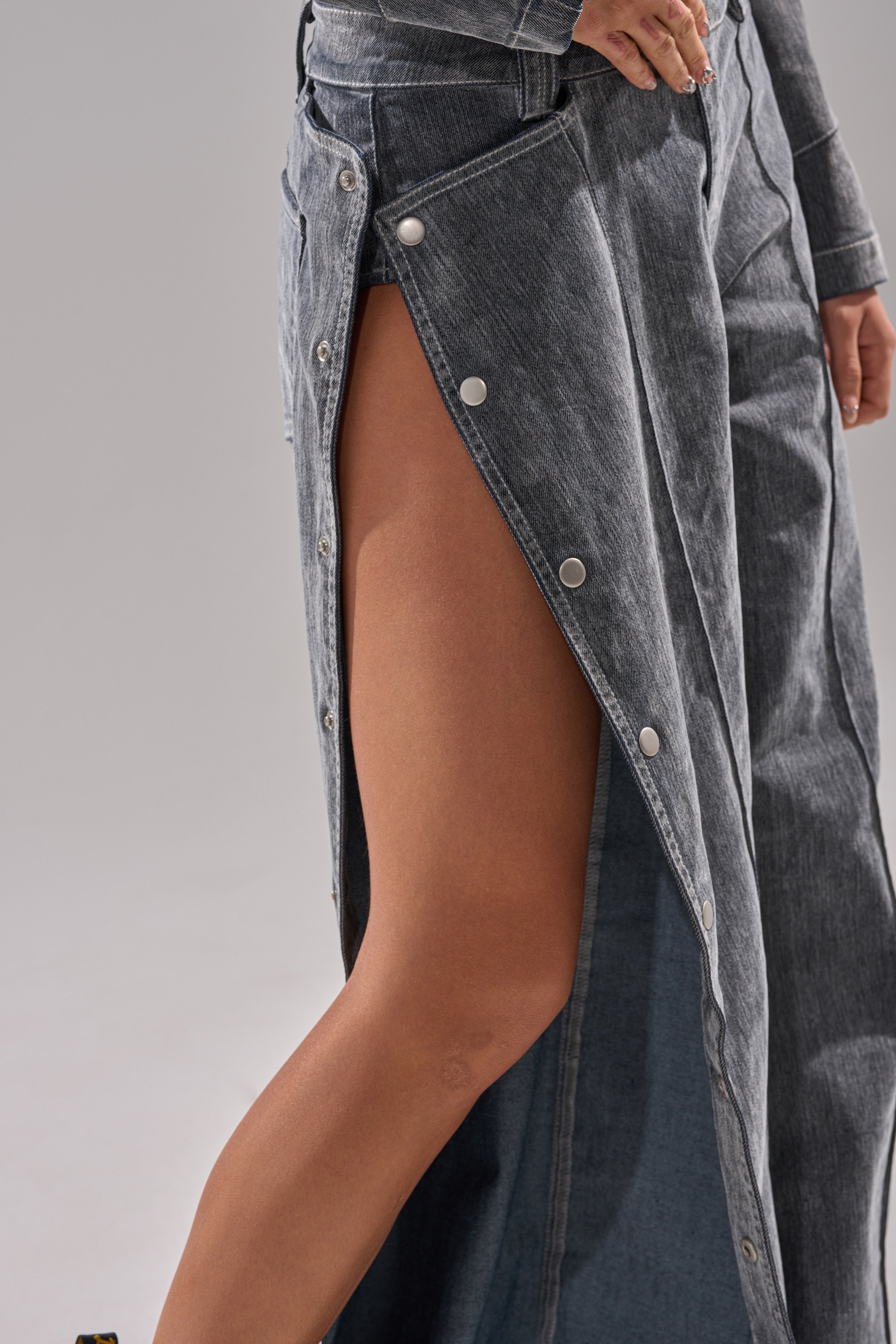Wearing the CATCHING EYES VELVET DENIM WIDE-LEG PANT in faded blue, paired with a denim jacket, channels a cool, high-rise vibe. The look is set against a plain, neutral background for standout style.