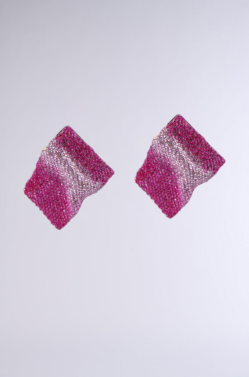 The ITS MY WORLD BLING EARRING, featuring two pink and silver sequined, square-shaped earrings with a textured, wavy design and rhinestone embellishments, is displayed against a plain gray background.