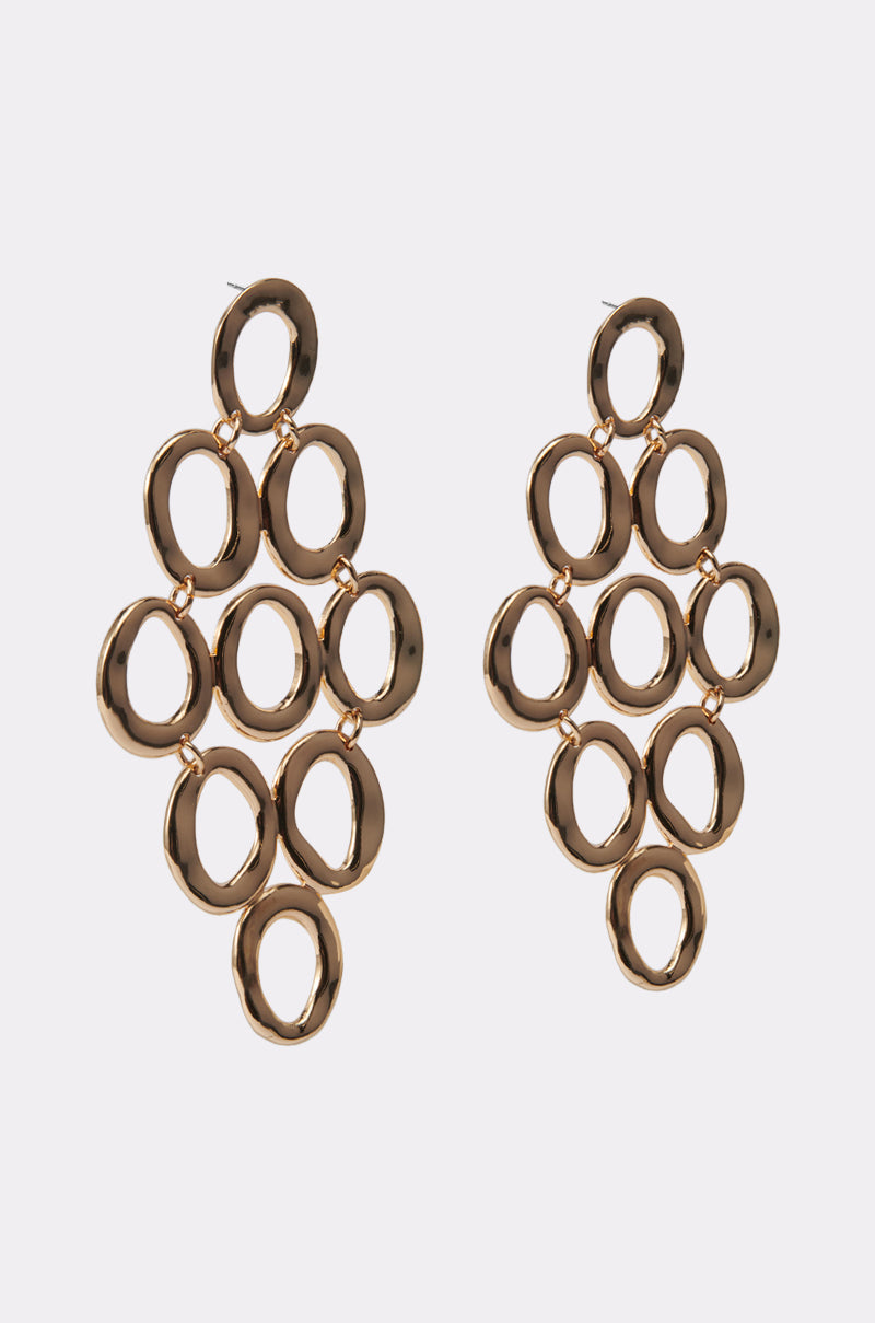 The OUTTA TOWN EARRING features gold-tone interlinked oval loops in a geometric diamond-shaped drop design, creating a bold statement accessory perfect for any outfit. 5