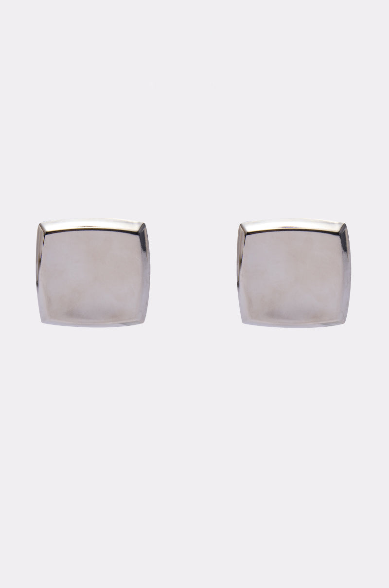 The NOT A SQUARE EARRING features a minimalist design with smooth, reflective silver surfaces, shown against a plain white background. 0