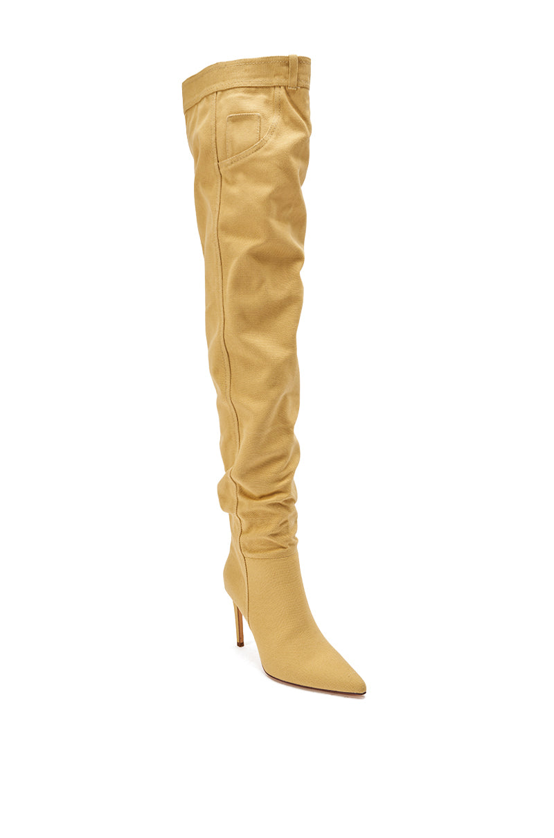 The AZALEA WANG JEANNI TAN PANT DETAIL OVER THE KNEE BOOT features a pointed toe, stiletto heel, a slouchy over-the-knee fit, and a small pocket detail near the top.