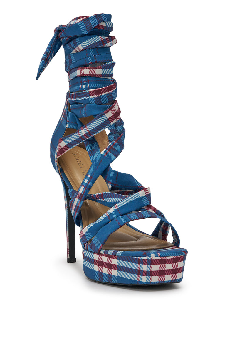 The AZALEA WANG JEMISHA BLUE PLAID PRINT PLATFORM STRAPPY SANDAL features a high heel, open toe, blue, white, and red plaid straps that lace up around the ankle with a chic tie closure. 4