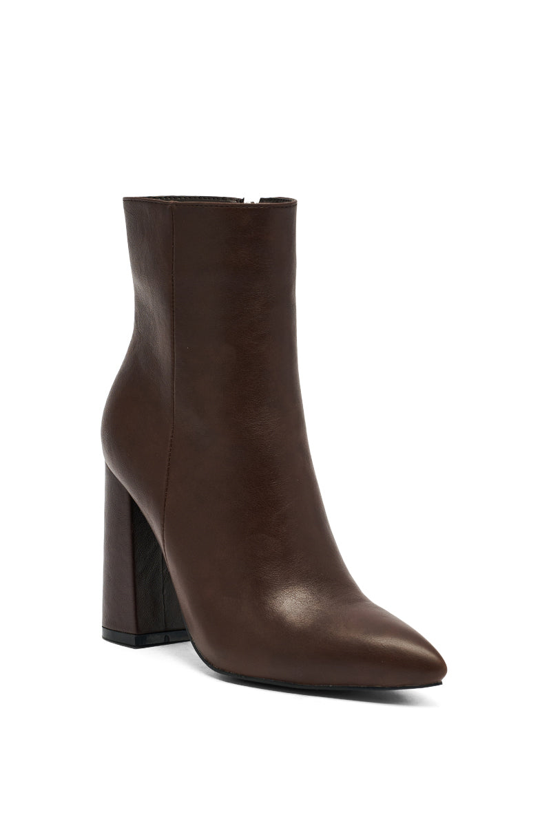 The AZALEA WANG JESSABELL Brown Pointed Toe Bootie features brown faux leather and a high chunky block heel, displayed against a plain white background.