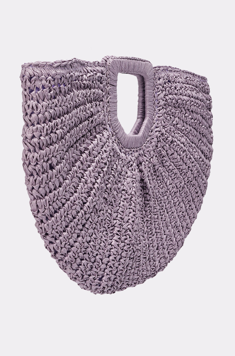 The CATCHING FLIGHT RAFFIA CLUTCH features a semi-circular silhouette, ruffled texture, and rectangular top handle—this woven straw bag adds effortless boho-chic style to your look. 2