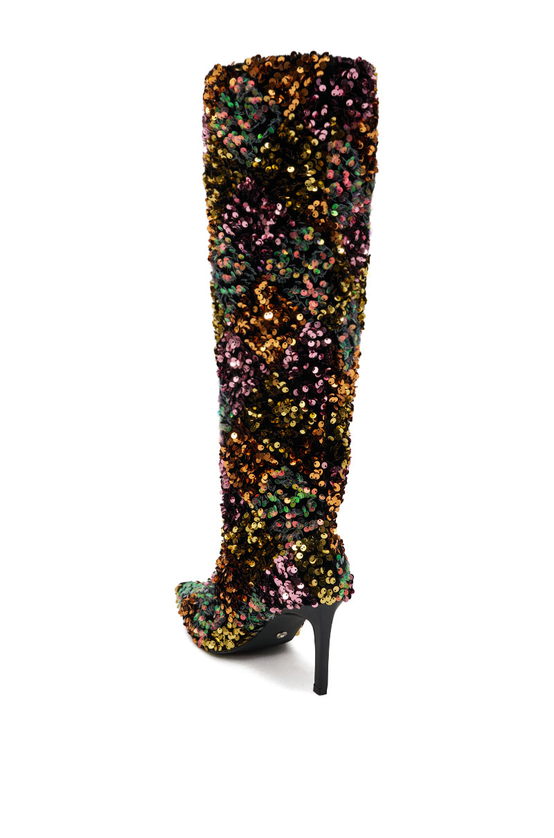 The AZALEA WANG JIMENA MULTI GOLD SEQUIN KNEE HIGH STILETTO BOOT features a pointed toe and is covered in multicolored sequins, with a high stiletto heel, shown against a white background.