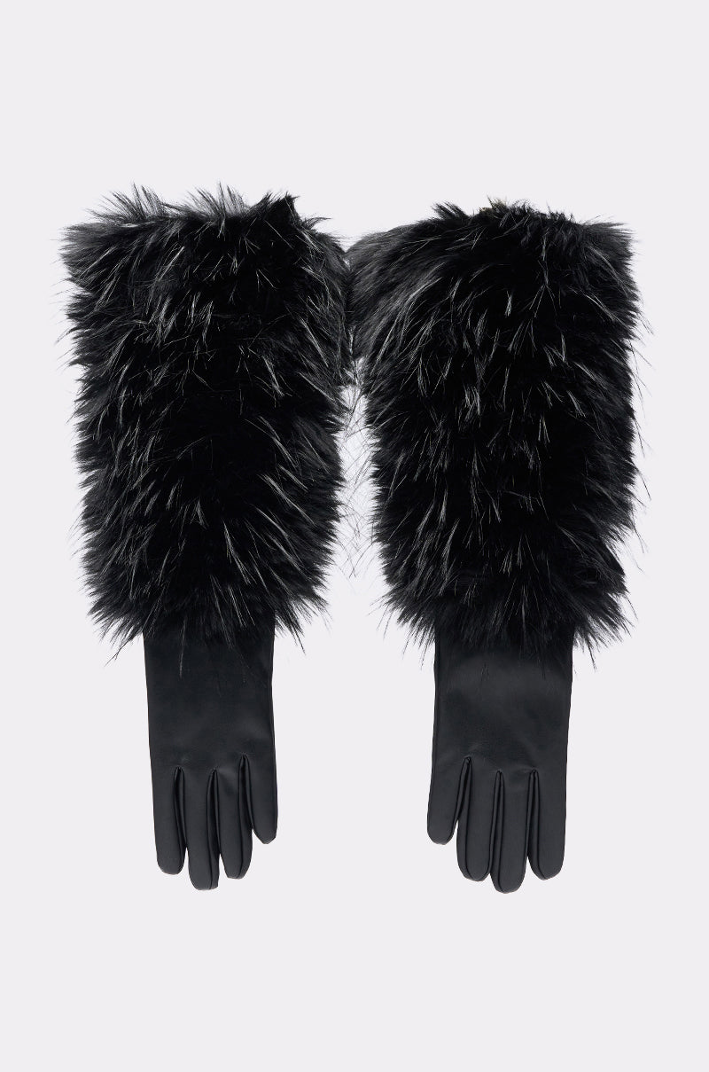 A pair of STAY EXPENSIVE FAUX FUR GLOVES featuring smooth leather hands and thick, fluffy black faux fur at the wrists and forearms, shown against a plain light background.