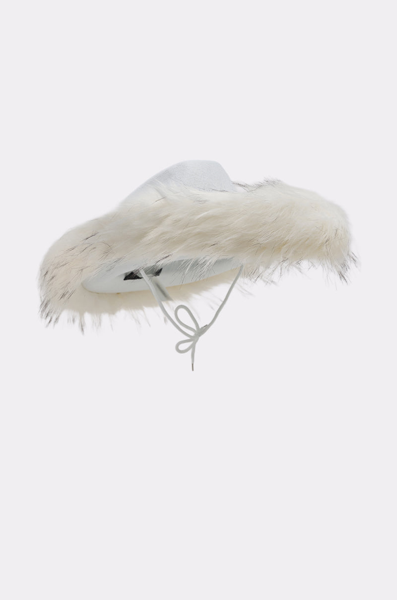 The LETS RIDE FAUX FUR TRIM COWBOY HAT is a wide-brimmed white hat with plush faux fur, feathered trim, and a thin chin strap, shown against a simple light background. 6