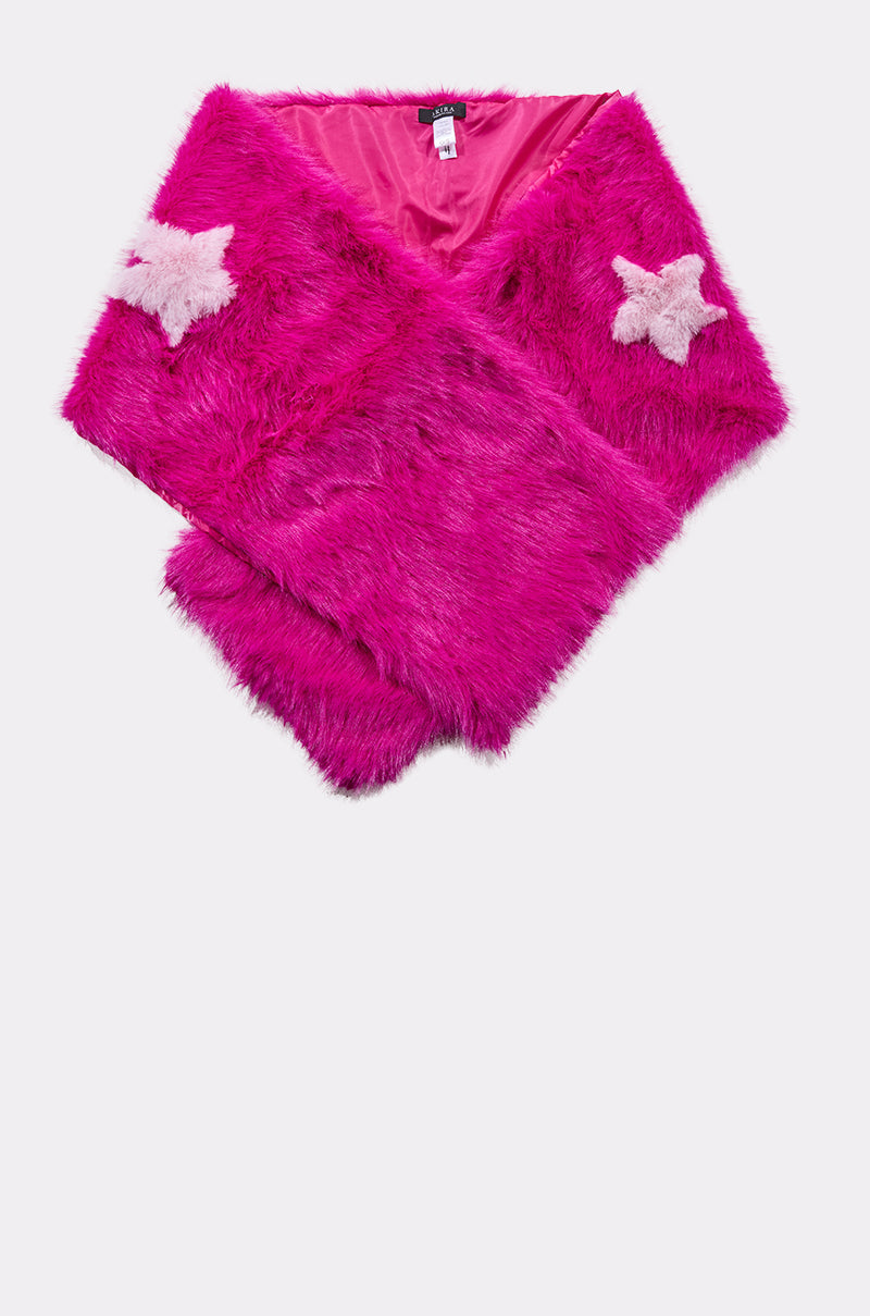 The STFU FAUX FUR SCARF is an oversized, bright fuchsia faux fur scarf with a shiny pink lining and two light pink star-shaped patches on one end, shown laid flat on a white background. 5