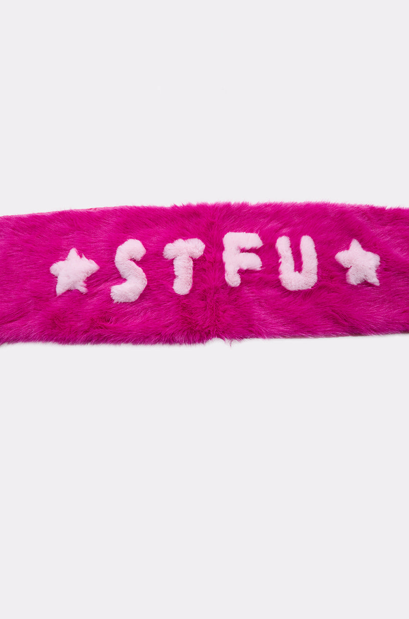 The STFU FAUX FUR SCARF is a bright fuchsia faux fur accessory featuring “STFU” in white letters and white stars on each side, shown against a plain background. 6
