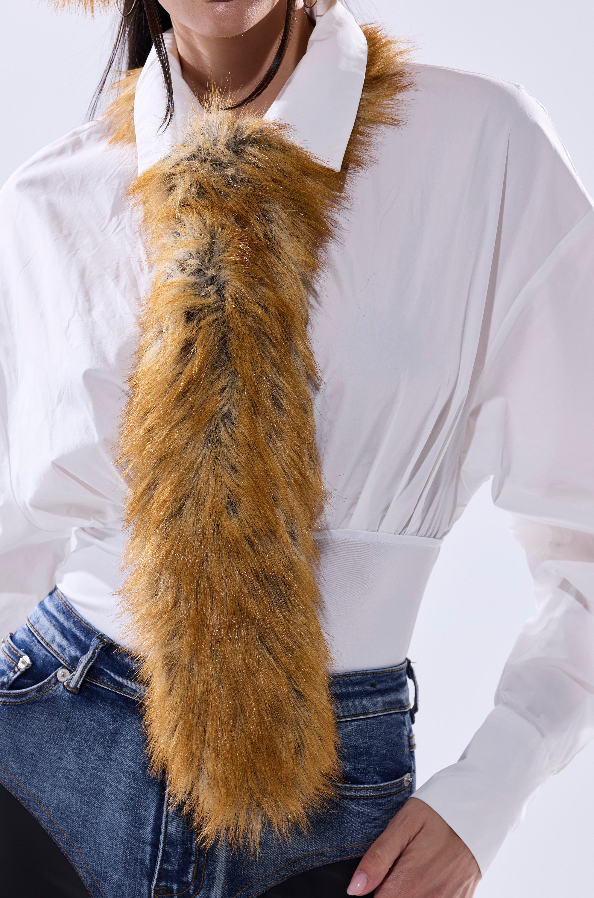 A person wearing a white collared shirt and blue jeans, accessorized with the REALLY LIKE THAT FAUX FUR TIE draped around their neck. 1
