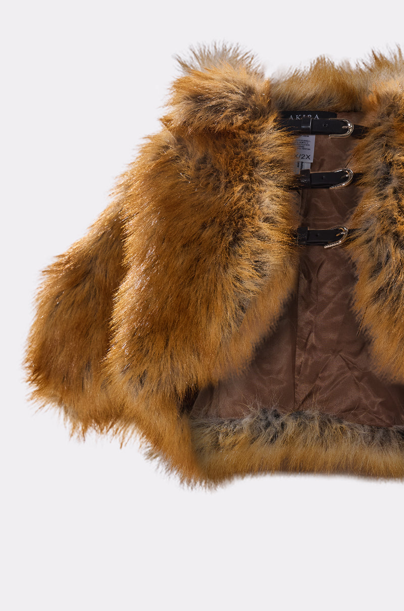 The LUXE LIFE FAUX FUR SHAWL IN BROWN features glossy brown faux fox fur, two dark brown front buckle closures, and a silky brown inner lining.