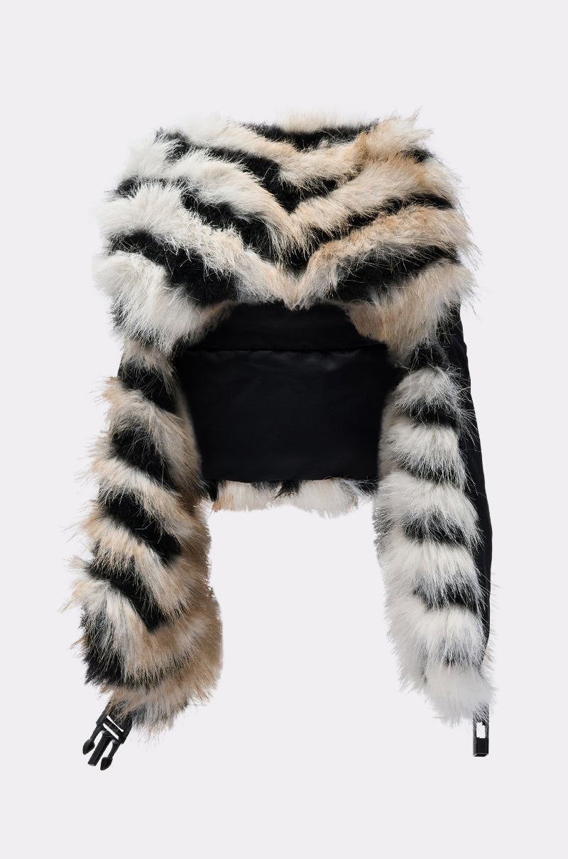 Pair a statement faux fur hat like the PORTIA AVIATOR HAT with this cropped jacket, featuring thick black, white, and tan striped faux fur, black body fabric, and zippered sleeves. 12