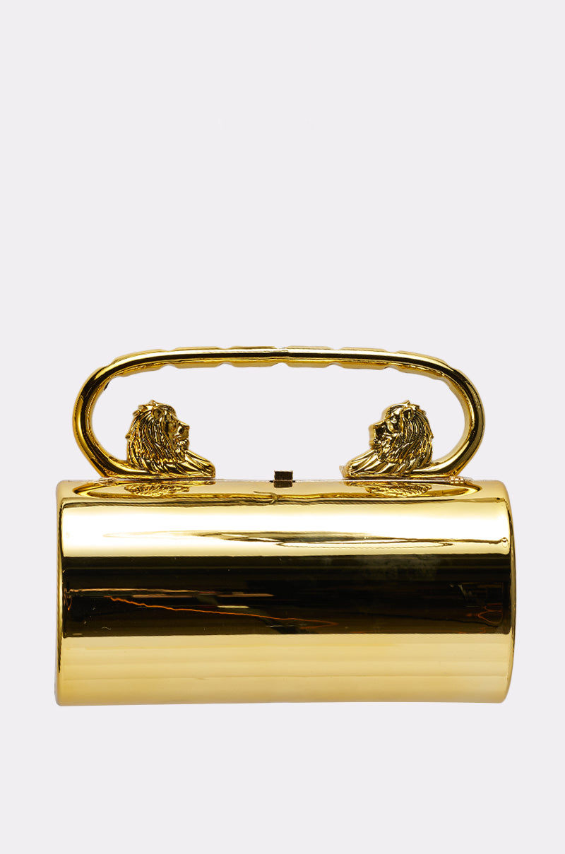 The LETS GO OUT CLUTCH BAG is a shiny metallic gold handbag with a handle adorned by two lion heads facing each other—an eye-catching accessory perfect for standout occasions. 0
