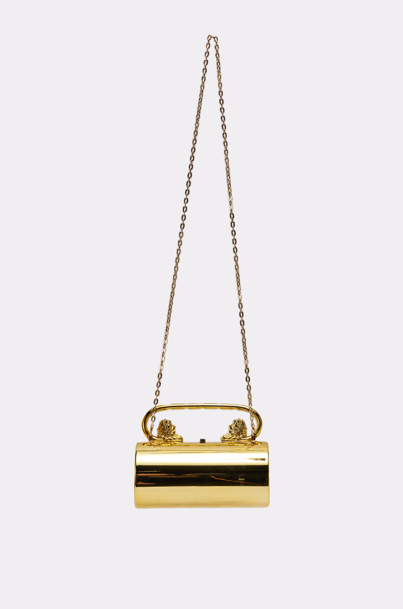 The LETS GO OUT CLUTCH BAG is a shiny metallic gold hardshell evening bag with decorative clasps and a long gold chain strap, shown against a plain light background. 4