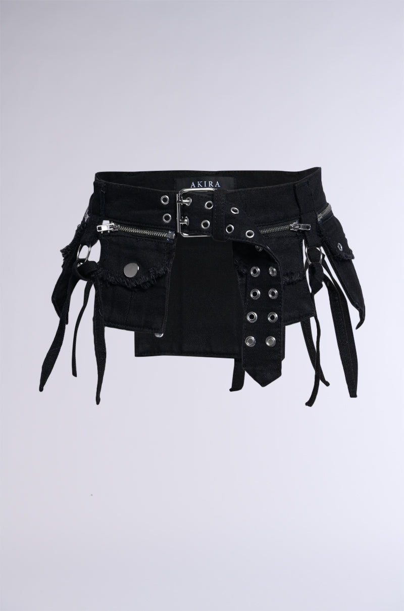 Introducing the STICK WITH THE TRENDS UTILITY BELT, a black utility belt adorned with multiple faux silver metallic hardware, straps, zippers, and distressed fabric details. It features a tag with the brand name "AKIRA" and boasts an edgy and utilitarian design with various hanging straps and a rugged appearance.