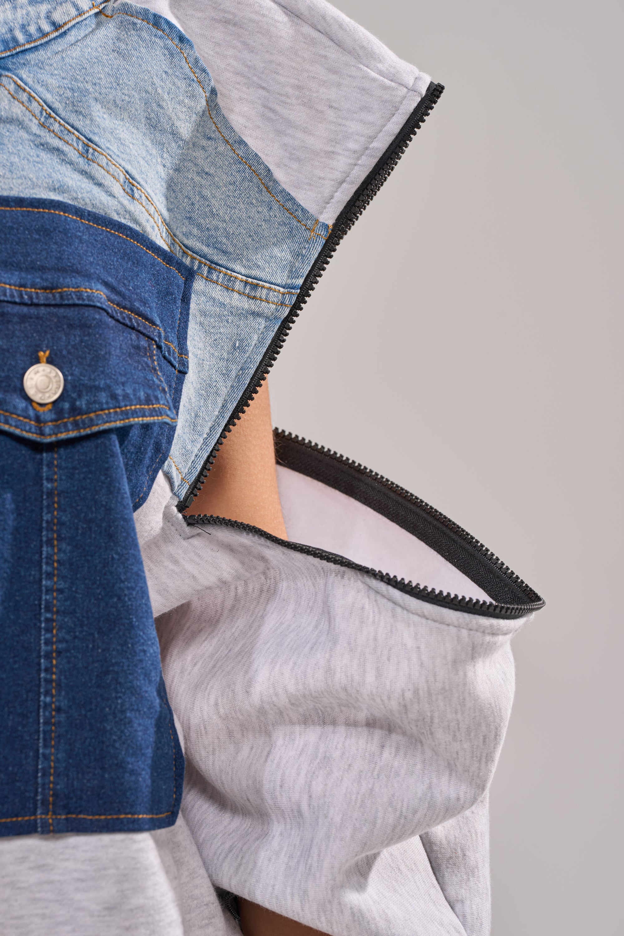 Someone wearing the ADIRA MINI SWEATER DRESS styled with a trendy jacket. 14