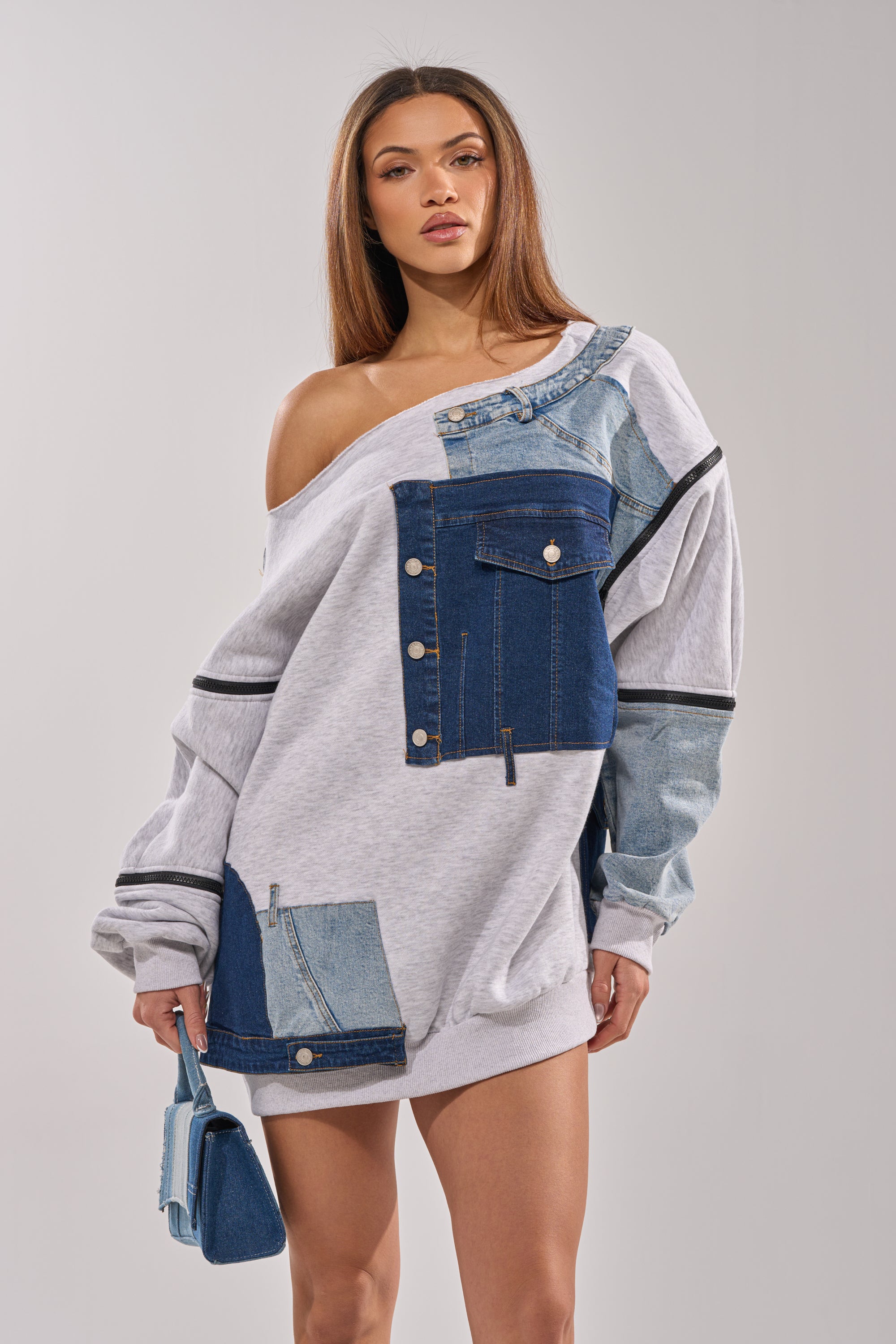 A woman wearing the ADIRA MINI SWEATER DRESS in blue and white. 4