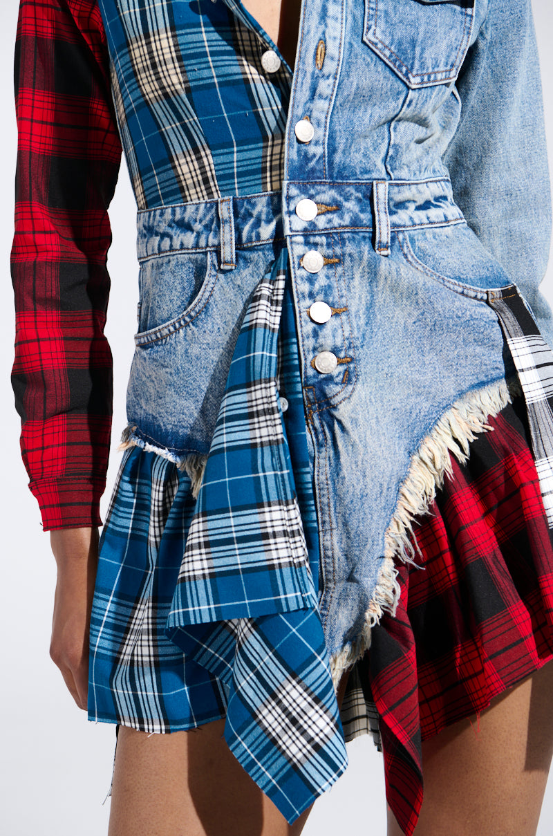 The PATCHWORK PLAID DENIM MINI DRESS showcases a punk-inspired look with mixed textiles like denim and blue-red plaid. It features buttons, frayed edges, and an asymmetric design that blends jacket and skirt elements for a bold statement.