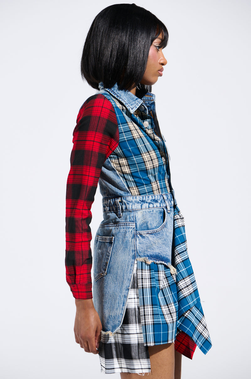 Someone showcases a bold, edgy look with the PATCHWORK PLAID DENIM MINI DRESS against a plain white background. The ensemble features mixed plaid patterns and denim, with a top that boasts red and black plaid sleeves, seamlessly complementing the blue plaid and denim layers.
