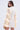 A woman with long dark hair wears the 