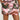 Someone is wearing the "WEAR IT TWO WAYS MINI SKIRT OR DRESS," featuring a nature-inspired, colorful pattern reminiscent of pink camouflage with pink, green, and brown leaves. The skirt has large front pockets against an off-white background.