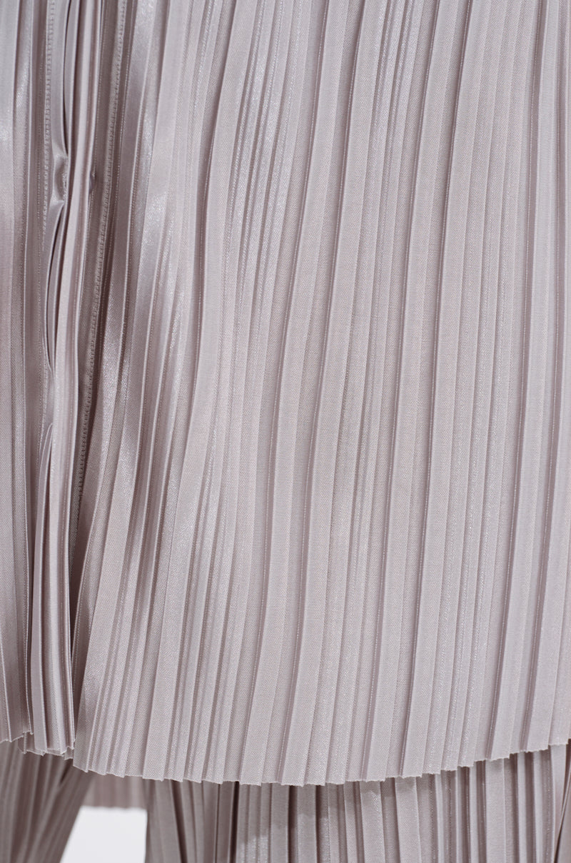 Close-up of ALIA SLINKY BUTTON DOWN in light gray satin-blend, highlighting its fine vertical folds, subtle sheen, silver hue, and textured repetitive lines.