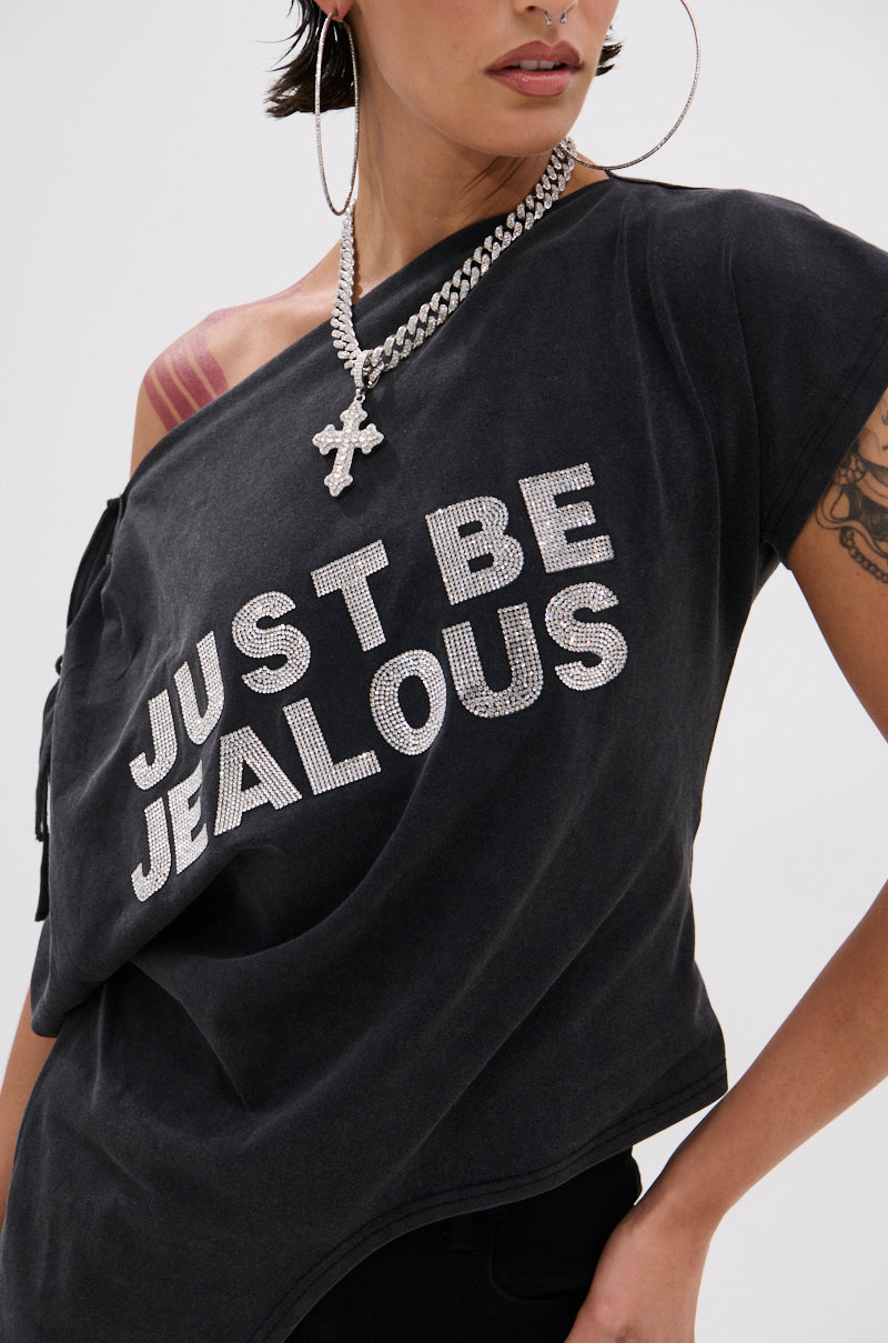 Someone styled the relaxed-fit JUST BE JEALOUS OFF THE SHOULDER TEE, featuring sparkling bedazzled text, with silver chain necklaces and large hoop earrings for a bold look.