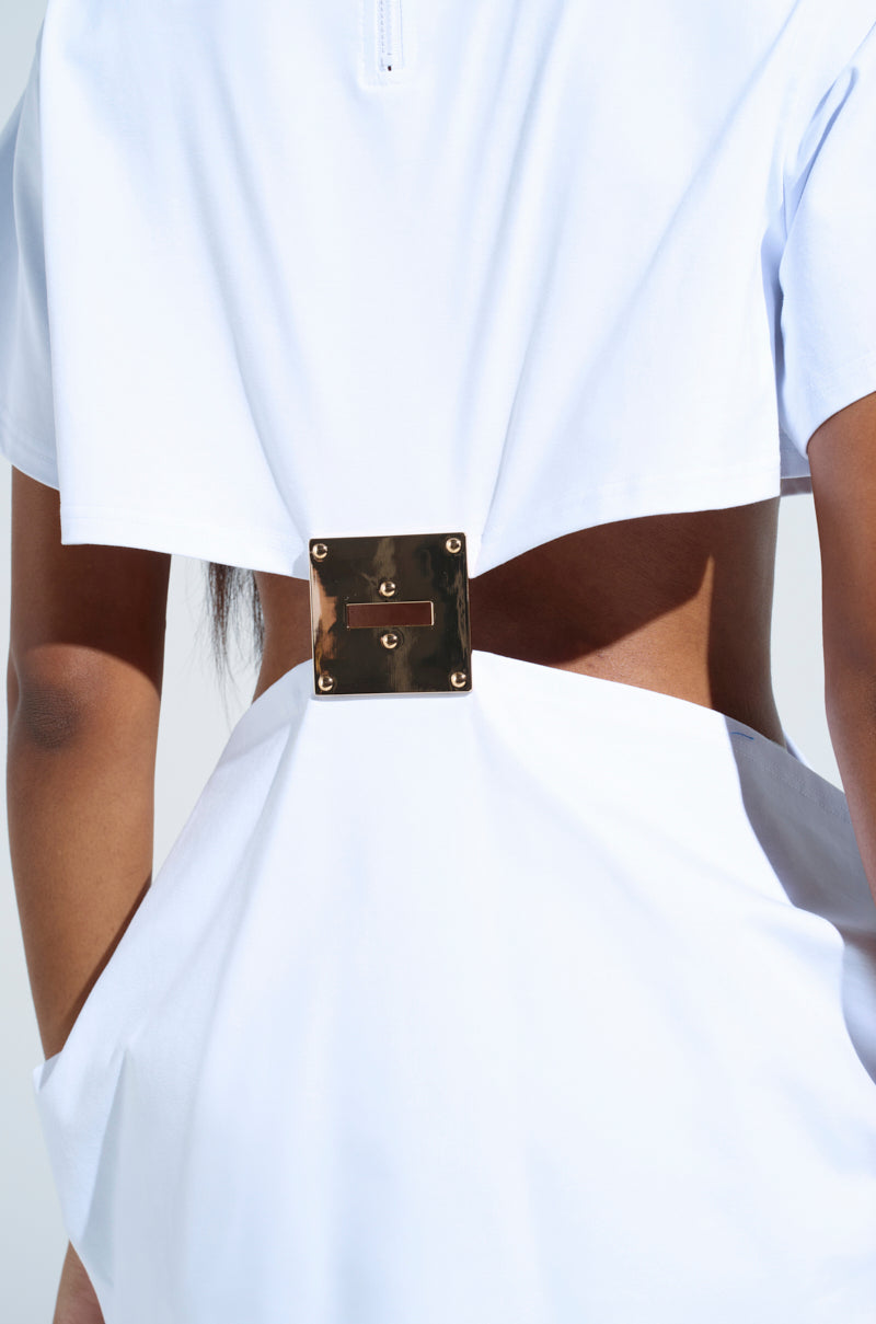 Dressed in the GIRL BOSS MOMENTS CUT OUT TSHIRT, a white top featuring an open back and a square metal clasp that shines against the fabric, one showcases high-fashion drama and bold modern elegance with its minimalist design.