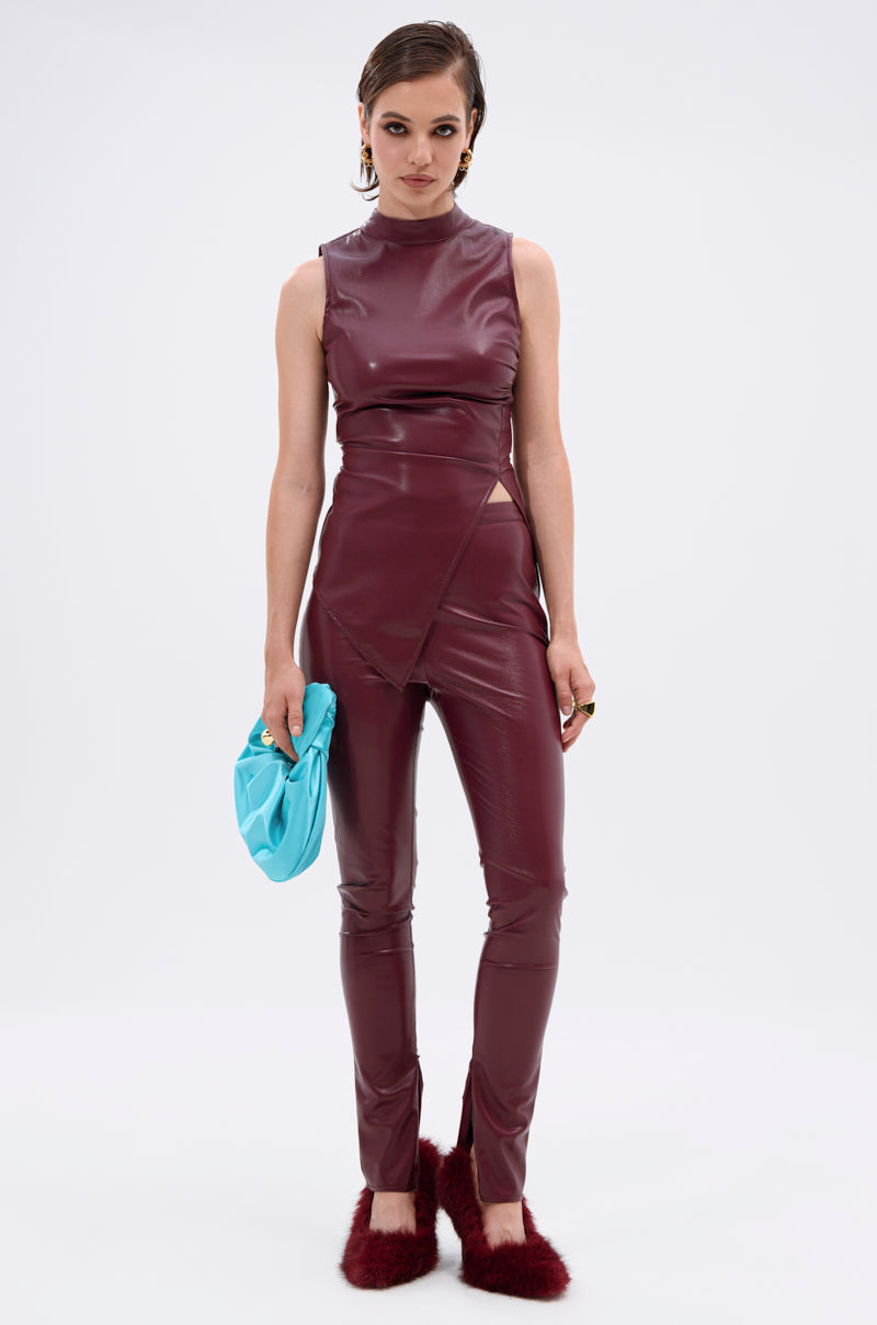 A woman wears the FIRE SQUAD BURGUNDY BLOUSE with matching maroon pants, holding a light blue clutch and wearing burgundy fuzzy slippers against a plain background. 7
