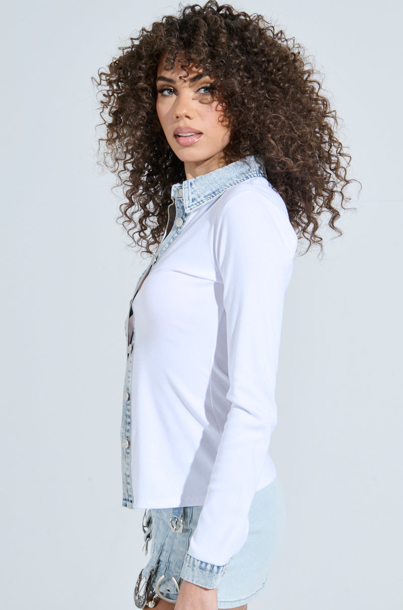 A person with curly hair wears the Rib Knit Denim Trim Button Down Collared Shirt in white and light denim shorts, standing in side profile against a plain light background, looking towards the camera.