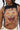 A woman wears the RAWR TANK—a sleeveless crop top boasting a bold tiger face print and decorative metal chains at the sides, finished in a flattering cropped fit.