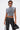 Wearing the ABLE TO SEE ME STRAPPY TOP—a gray lace-up crop top with hanging ties—paired with black grommet-detail pants, dark sunglasses, and a black handbag, this streetwear look pops against a plain white background.