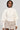 A person wearing a stylish ensemble featuring the 