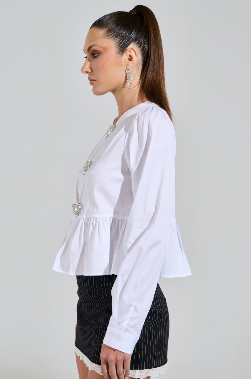 With long hair tied in a ponytail, they're wearing a Diamond Bow Button Up with a black pinstripe skirt with lace trim, posing in profile against a plain background and embodying the elegance of Coquette Fashion.