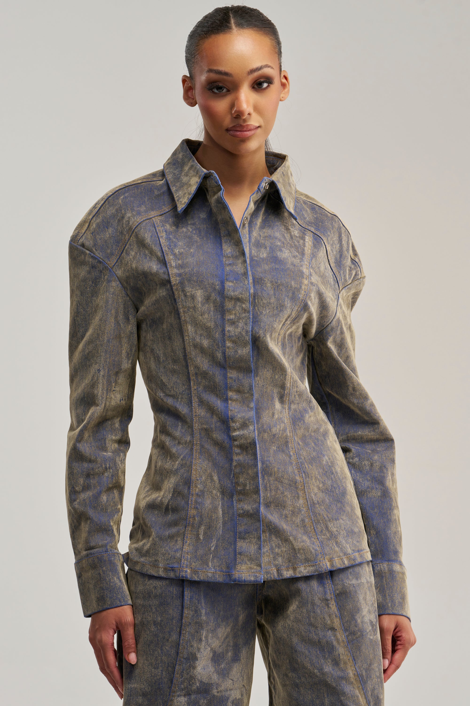 Clad in the FALL VIBES VELVET DENIM BUTTON DOWN IN TAUPE and matching pants, a person stands facing the camera against a plain background, embodying the effortlessly cool vibe of fall streetwear.