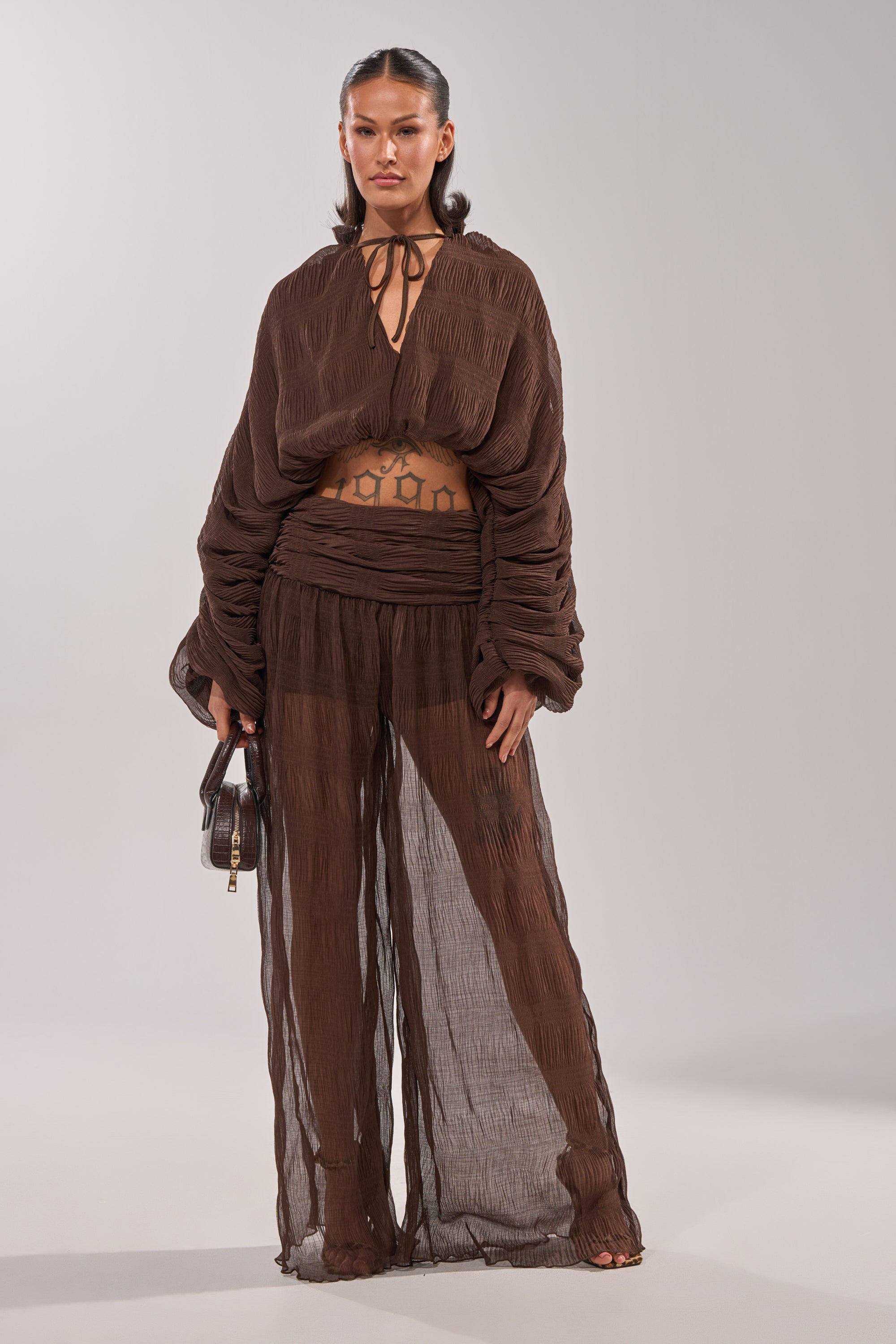 A woman in the BABY THATS HOW I WANT IT PALAZZO PANT brings effortless elegance to her look with these stylish wide-leg pants. 9