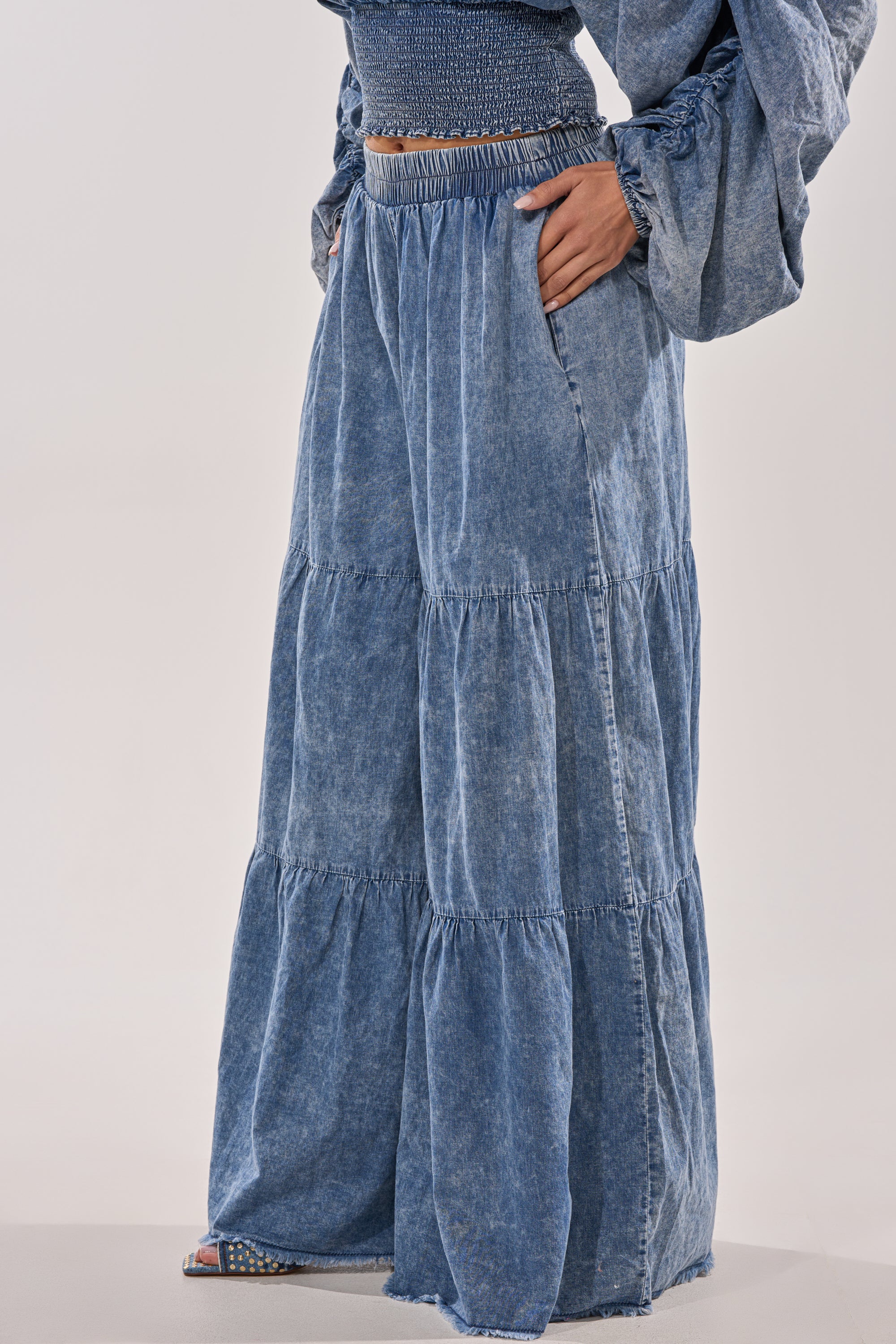 A person wearing the DENIM FOR DAYS PALAZZO PANT with a matching long-sleeve top stands against a light background.