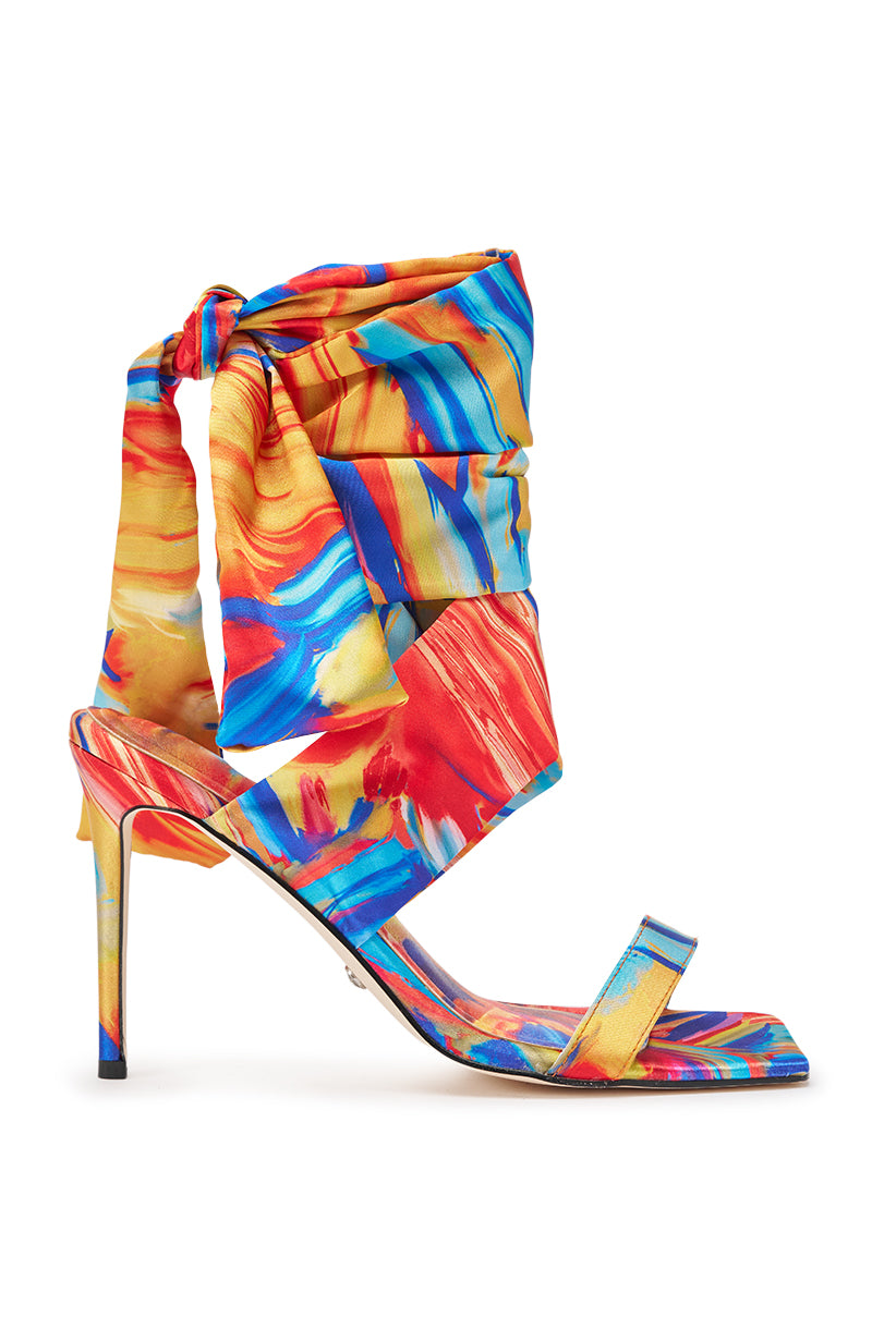 The AZALEA WANG JOHA ORANGE MULTI PRINTED SATIN WRAP UP STILETTO is a colorful high-heeled shoe with a satin stiletto heel and wraparound printed satin straps. 3