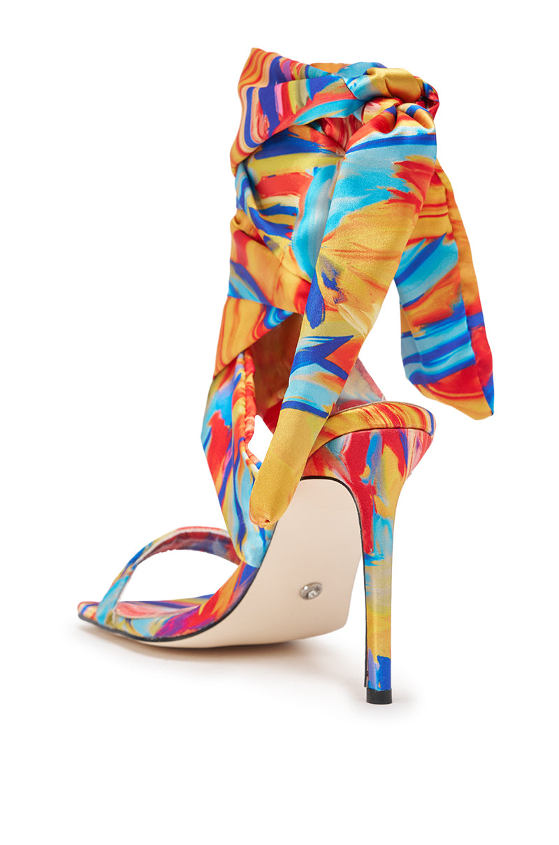 The AZALEA WANG JOHA ORANGE MULTI PRINTED SATIN WRAP UP STILETTO features vibrant multi-color print, wraparound satin straps tied in a bow, an open toe design, and a slim satin stiletto heel—adding bold elegance to any outfit. 5