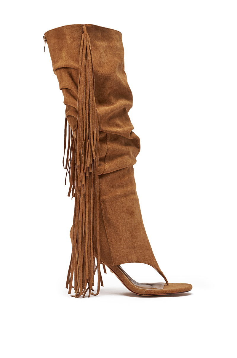 The AZALEA WANG JOHANNA TAN FRINGE GLADIATOR SANDAL is a brown faux suede stiletto with an open toe, knee-high slouchy shaft, and long side fringe detailing. 2